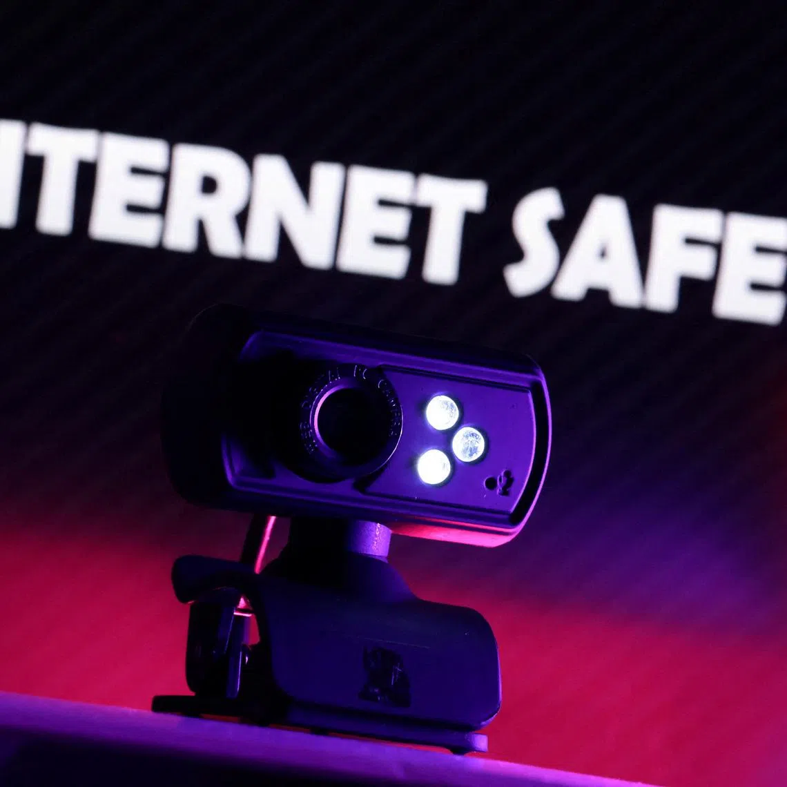 A web camera is seen in front of the displayed words \"Internet Safety\" in this illustration taken October 21, 2025. REUTERS/Dado Ruvic/Illustration