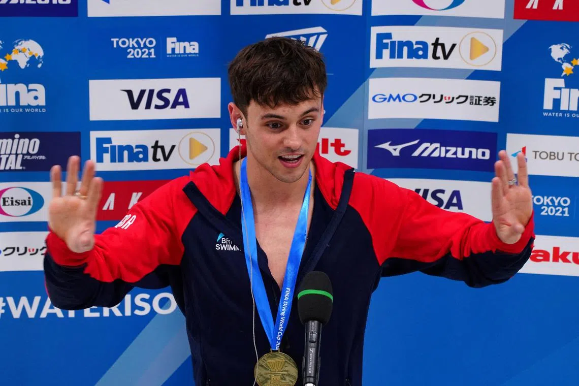 FILE PHOTO: Diving - FINA Diving World Cup 2021 and Tokyo 2020 Olympics Aquatics Test Event - Tokyo Aquatics Centre, Tokyo, Japan - May 4, 2021  Gold medallist, Britain's Tom Daley during an interview after winning the men's 10m platform final REUTERS/Naoki Ogura/File Photo