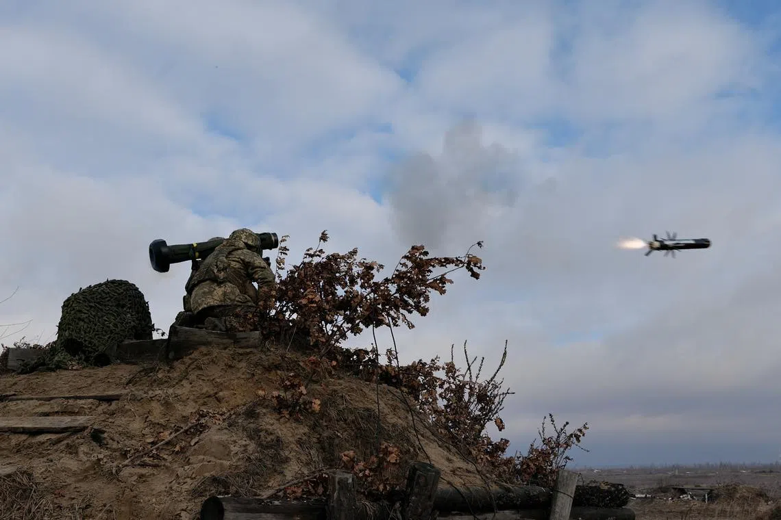 Service members of the Ukrainian Armed Forces fire a Javelin anti-tank missile during drills at a training ground in an unknown location in Ukraine, in this handout picture released February 18, 2022. Ukrainian Joint Forces Operation Press Service/Handout via REUTERS/File Photo