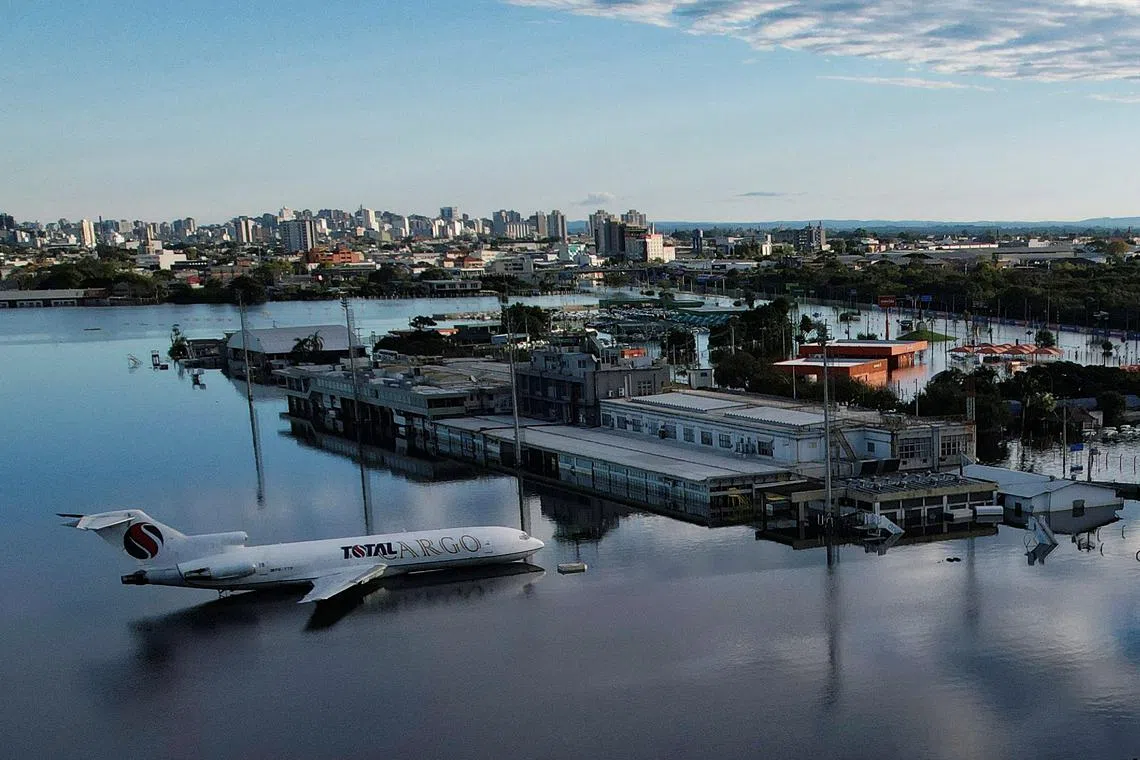 A drone view shows an airplane sitting on a flooded runway at the airport in Porto Alegre, Rio Grande do Sul, Brazil, May 17, 2024. REUTERS/Adriano Machado/ File Photo