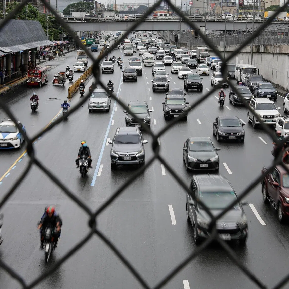 Heavy traffic in Quezon City, Metro Manila in the Philippines, which has been hurt by high oil prices sparked by the Middle East war and a corruption scandal.