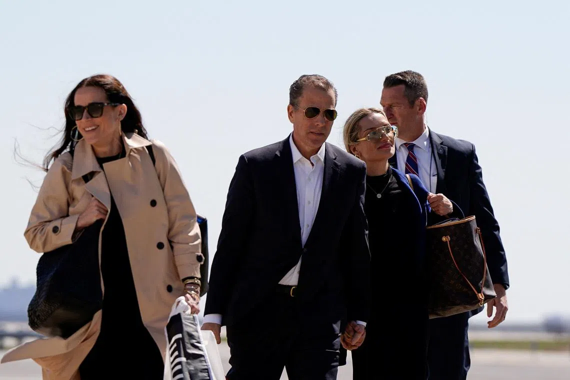U.S. President Joe Biden's son Hunter Biden, his wife and Ashley Biden walk to board Air Force One en route to Joint Base Andrews, from John F. Kennedy International Airport in New York, U.S., March 29, 2024. REUTERS/Elizabeth Frantz
