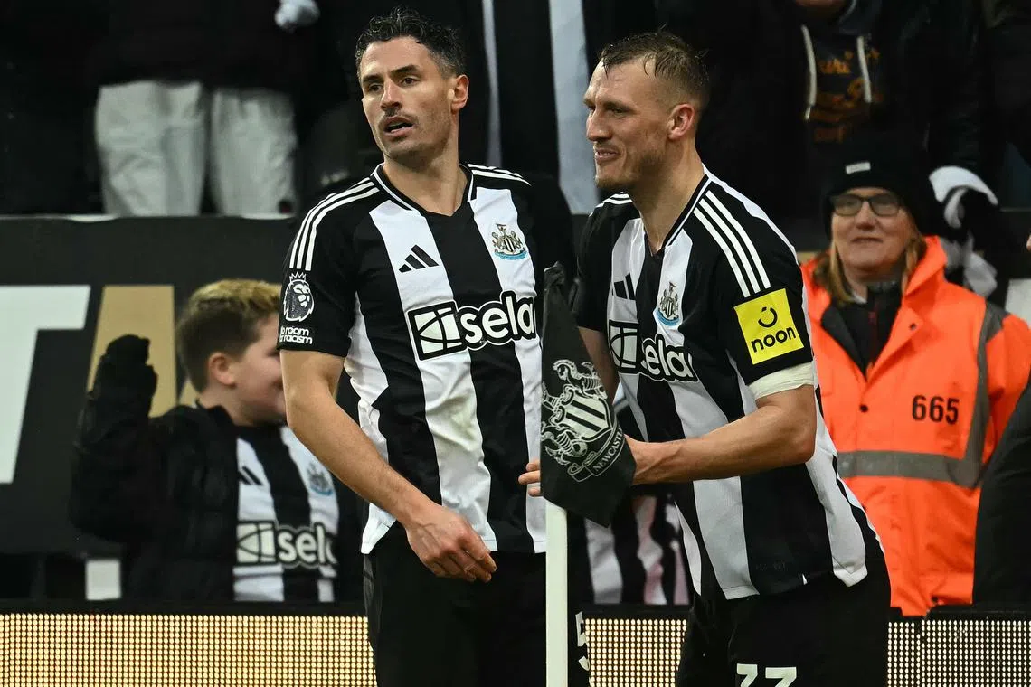 Newcastle United's Fabian Schar (left) pounced on a mistake by Liverpool keeper Caoimhin Kelleher in the 90th minute to equalise for his team.