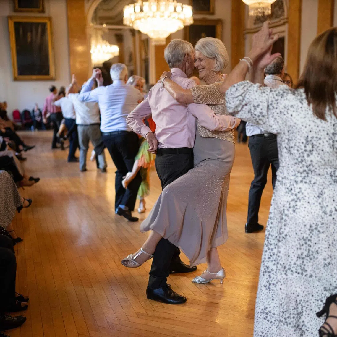Ballroom dancers taking part in a tea dance, a lively antidote to getting older in Britain, in the main ballroom of Liverpool Town Hall on Nov 17.