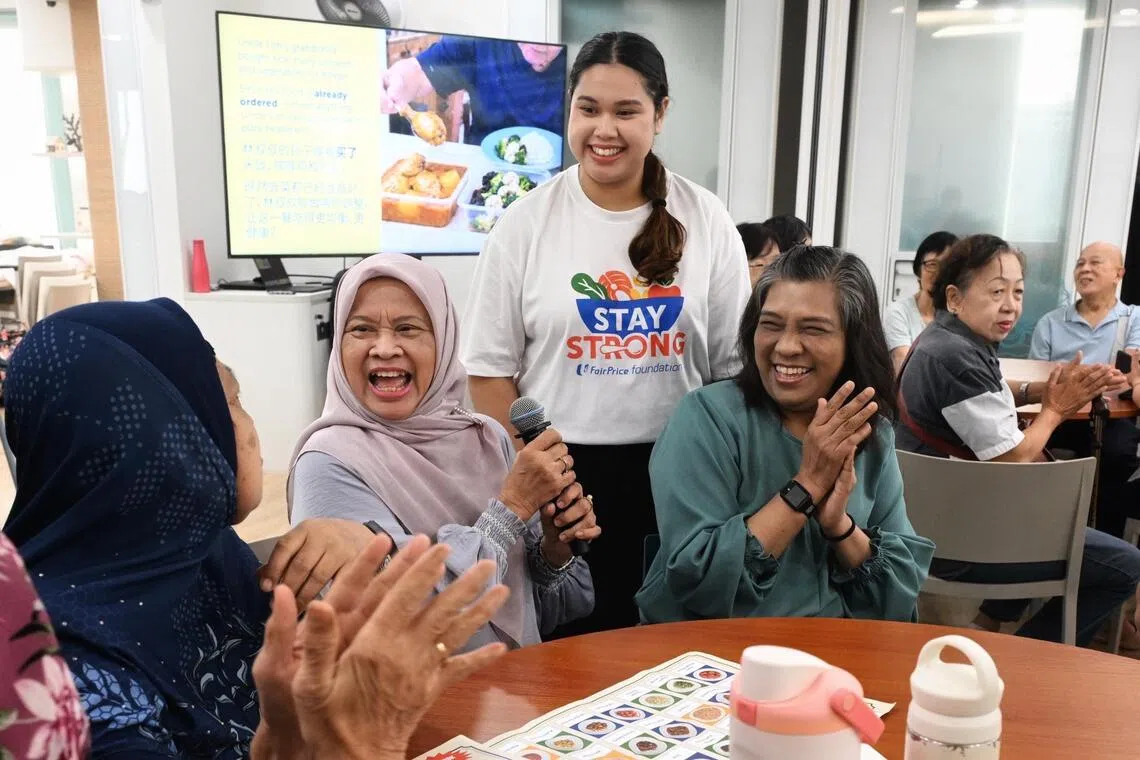 Rosna Abdul Rahman seated, second from left) participating in the Stay Strong programme on Sept 28.