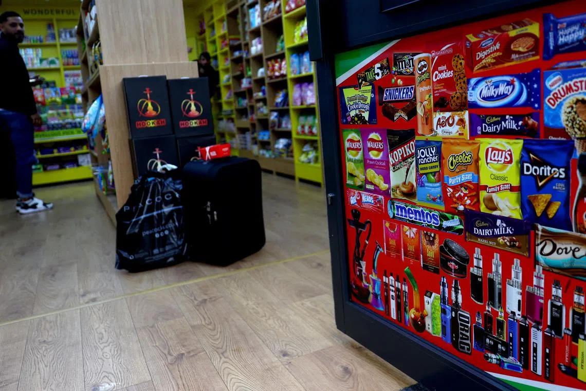 FILE PHOTO: Disposable vapes are advertised on a shop door, Newcastle-under-Lyme, Britain, September 14, 2023. REUTERS/Carl Recine