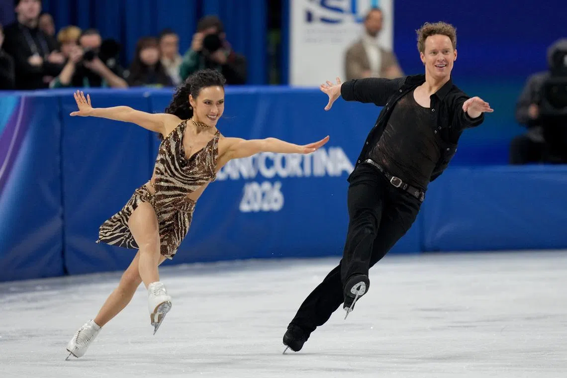 Feb 9, 2026; Milan, Italy; Madison Chock and Evan Bates of the United States of America skate during ice dancing at the Milano Cortina 2026 Olympic Winter Games at Milano Ice Skating Arena. Mandatory Credit: James Lang-Imagn Images