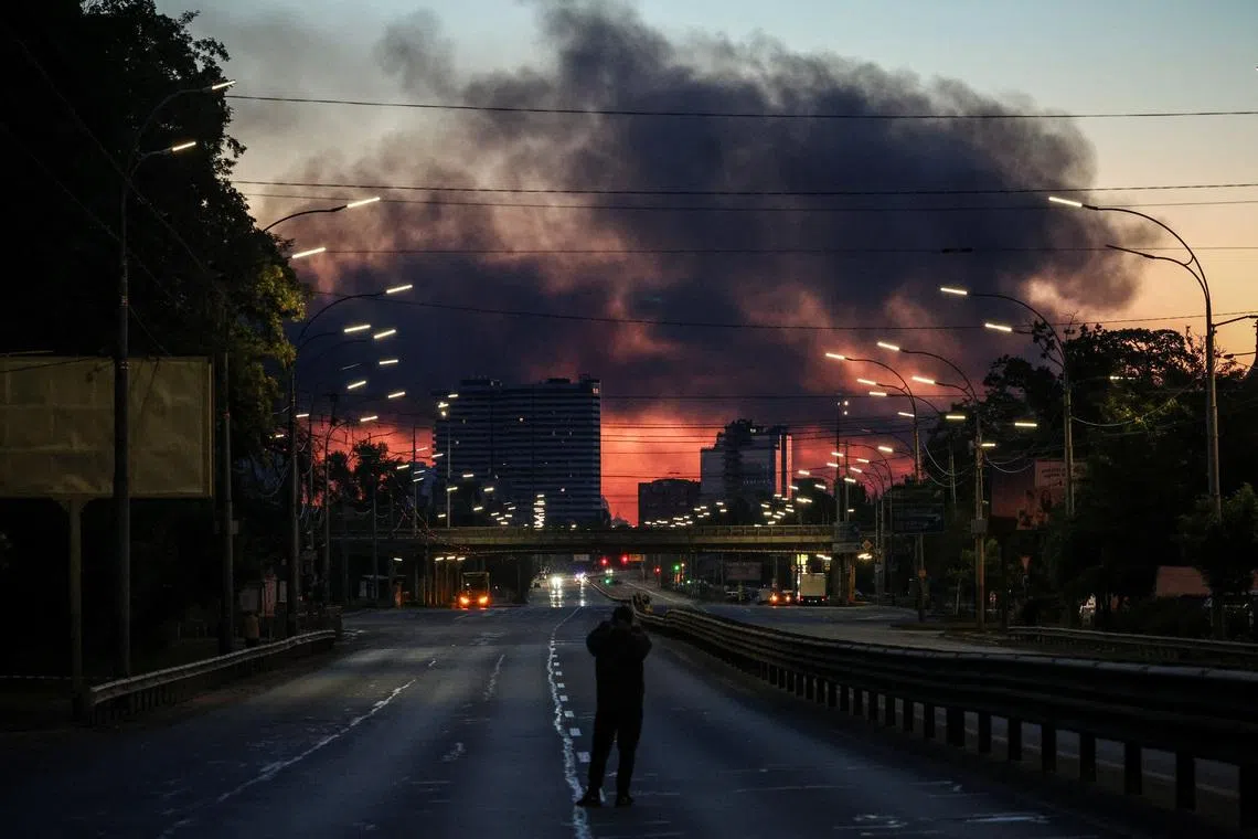 Smoke rises in the background after an overnight Russian missile and drone strike in Kyiv on June 2. Russia struck major Ukrainian centres including Kyiv, Dnipro and Kharkiv early that day.