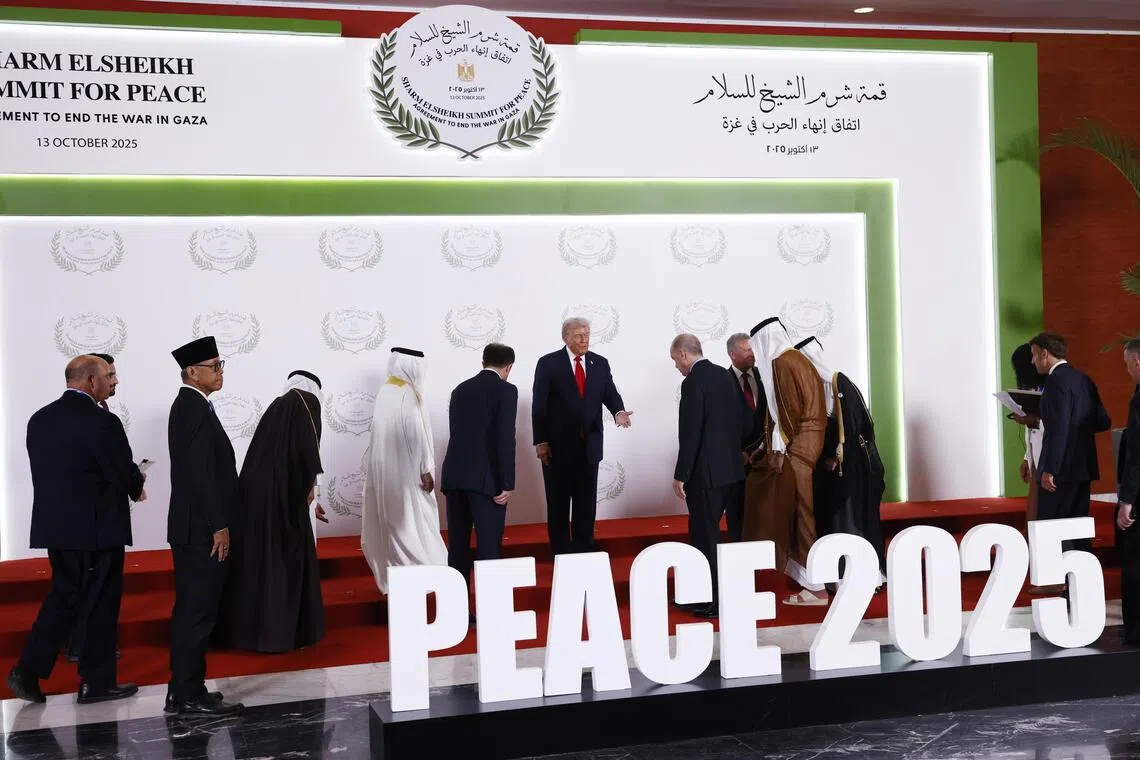 US President Donald Trump taking centre stage at the summit on Gaza in Sharm el-Sheikh, Egypt, on Oct 13.