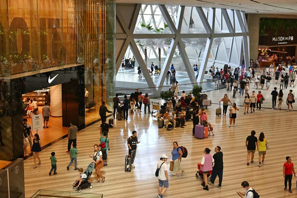 Economists say that while consumption may be starting to retreat for some, overall spending momentum is still going strong.