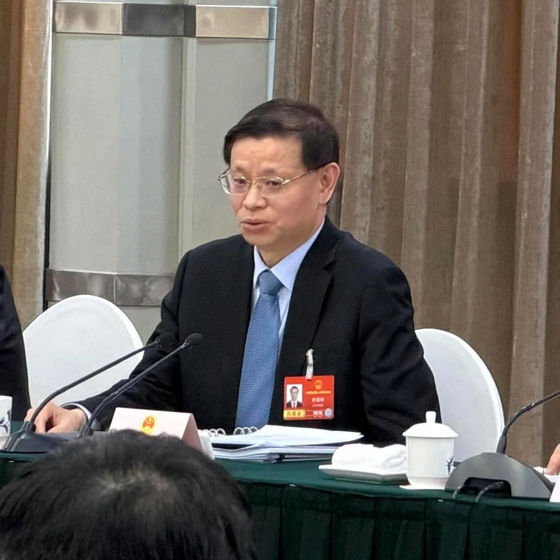 ltliaoning - Liaoning party chief Xu Kunlin (middle) blames cadres for not creating a pro-business environment for companies. 
He was speaking at a meeting of Liaoning parliamentarians on March 6 during the Two Sessions in Beijing. 
ST PHOTO: YEW LUN TIAN