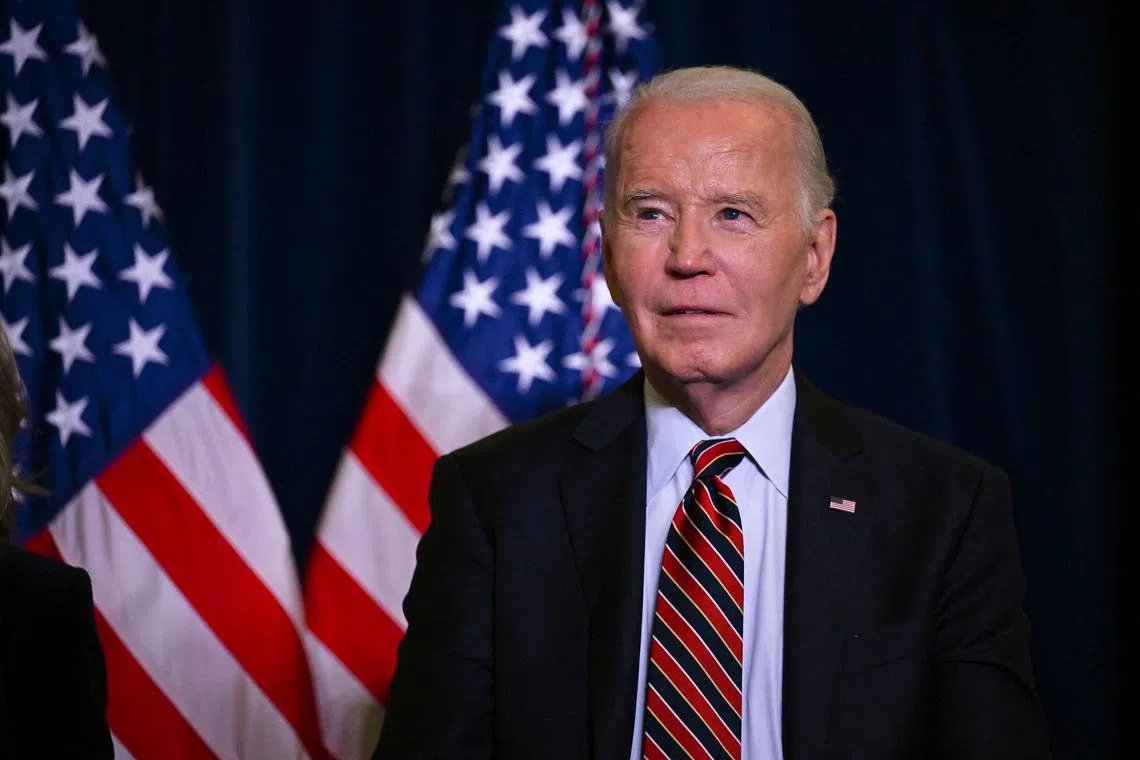 FILE PHOTO: U.S. President Biden looks on before delivering remarks at the Democratic National Committee's Holiday Reception at the Willard Hotel in Washington, U.S., December 15, 2024. REUTERS/Annabelle Gordon/File Photo