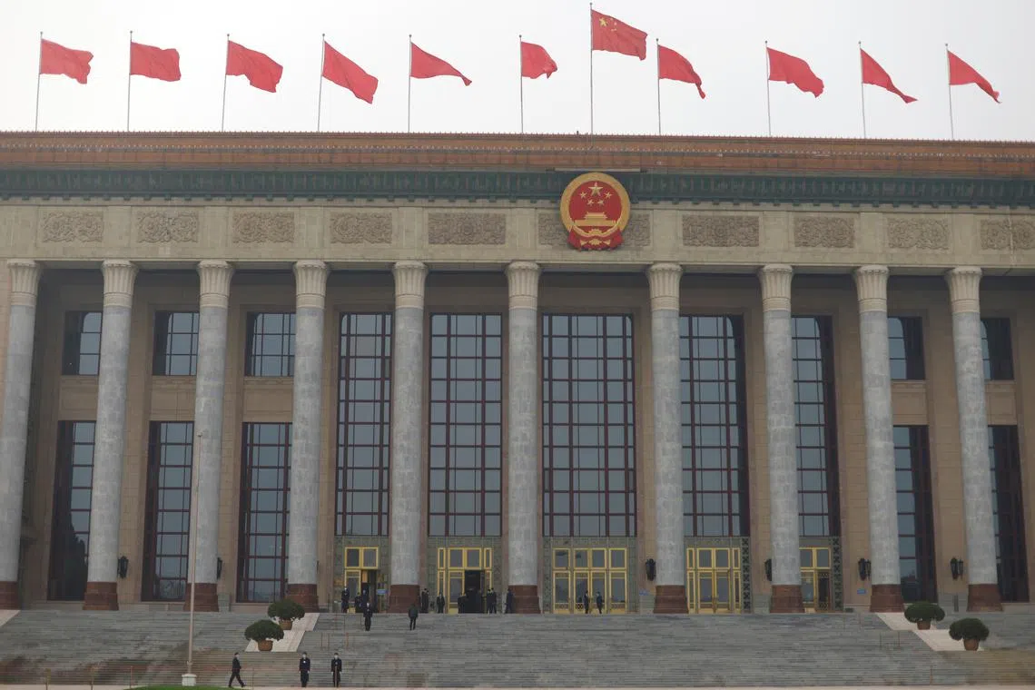 Security personnel stand guard outside the Great Hall of the People before the closing session of the Chinese People's Political Consultative Conference (CPPCC) in Beijing, China March 10, 2021. REUTERS/Carlos Garcia Rawlins