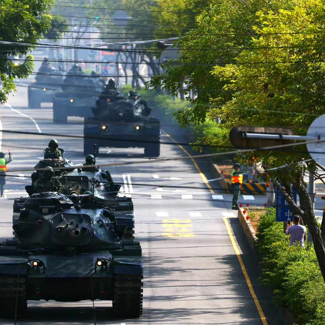 FILE PHOTO: Soldiers drive M60 tanks on a street as part of a military drill in Taichung, Taiwan, November 3, 2020. REUTERS/Ann Wang/File Photo