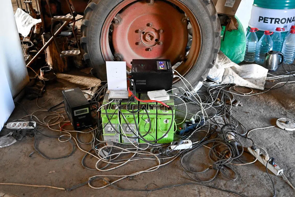 A view of the Starlink satellite-based broadband system set-up in a village in the Kherson border region, outside of Mykolaiv on October 31, 2022. (Photo by BULENT KILIC / AFP)