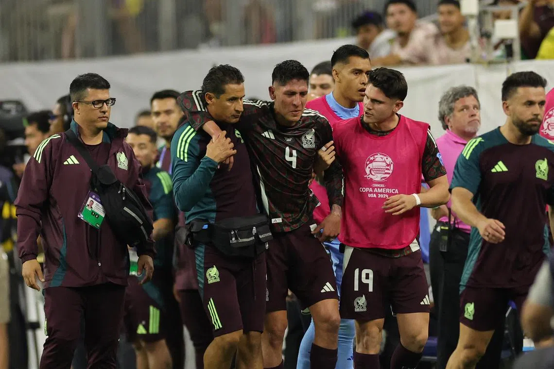 Mexico's Edson Alvarez leaving the pitch after suffering an injury during their Copa America opener against Jamaica on June 22.