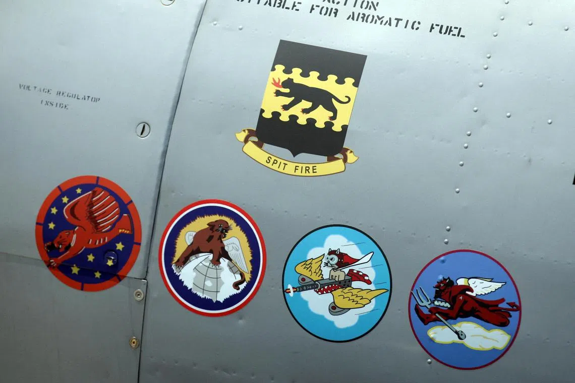 The insignias for the five Tuskegee Airmen squads are seen on the side of a Tuskegee Army Airfield AY-6 Texan fighter plane during a ceremony to honour the airmen at Selfridge National Airbase in Michigan.