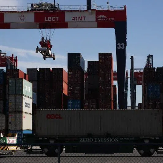 A stacking crane moving shipping containers at a port in Long Beach, California. Geoeconomic confrontation topped the global risks in 2026, the WEF said.