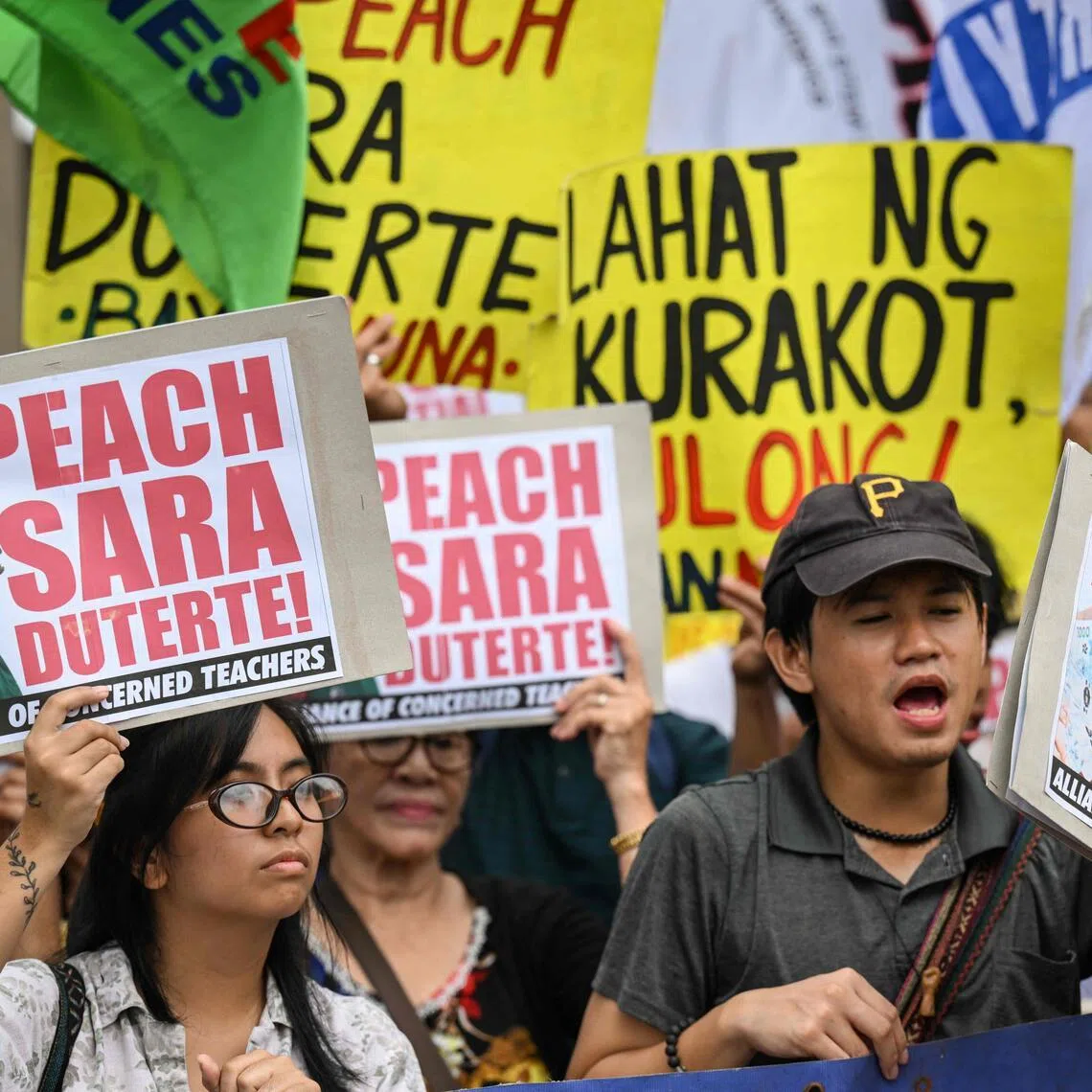 Protesters call for the impeachment of Philippine Vice-President Sara Duterte outside the House of Representatives in Manila.
