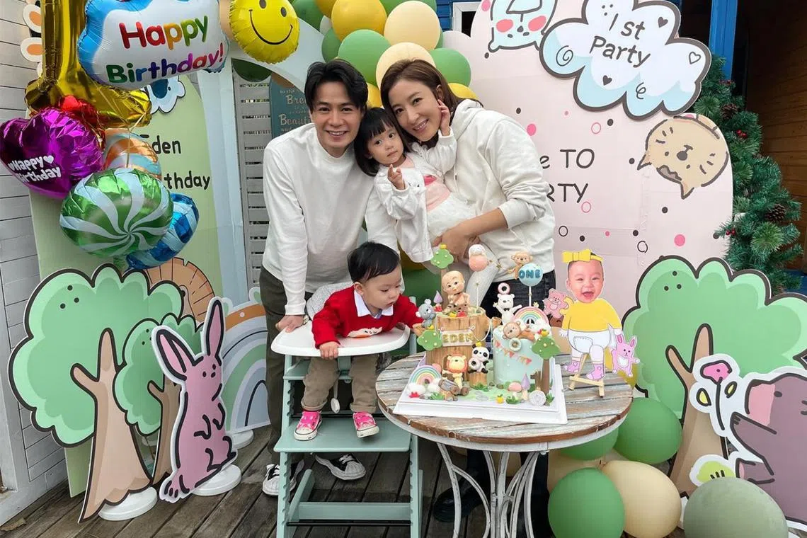 Hong Kong actor Him Law (left) and actress Tavia Yeung (right) with their daughter Hera and son Eden. 