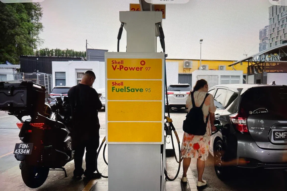 Motorists refuelling their vehicles at a Shell petrol station along Jalan Lingkaran Dalam in Johor Bahru on March 31.