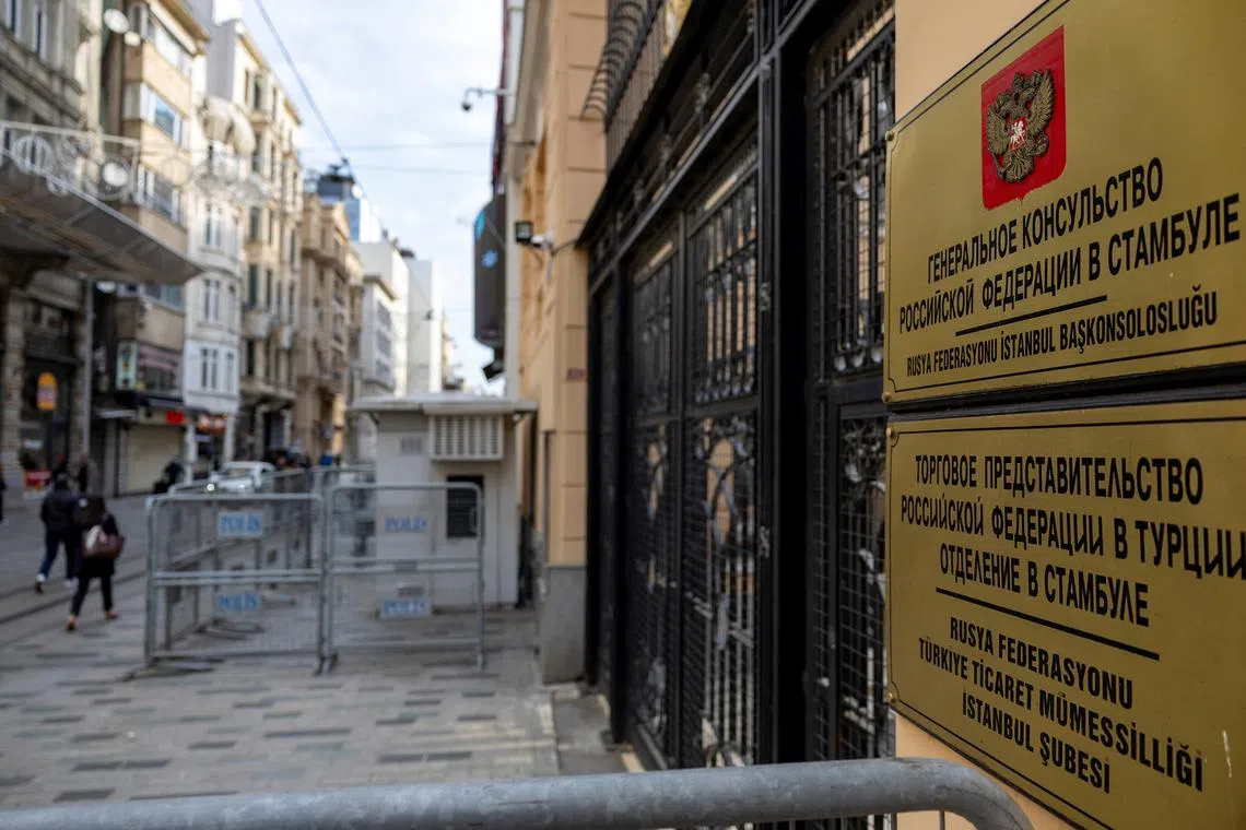 People walk past Russian Consulate where American and Russian delegations meet for a second time,  to discuss stabilising bilateral embassy operations, in Istanbul, Turkey, April 10, 2025. REUTERS/Umit Bektas