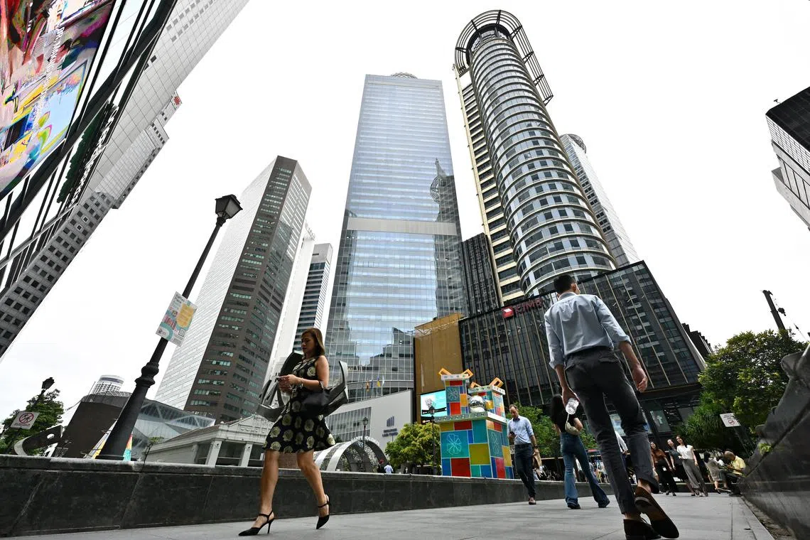 ST20241210-02403200563-Lim Yaohui-pixgeneric/
Office workers walking at Raffles Place Park within the heart of Singapore's financial centre in the CBD area on Dec 10, 2024.
Can be used for stories on PMET, money, population, property, land, commercial, office, invest, budget, income, bank, finance, financial, CBD, URA, population, economy, and development.
(ST PHOTO: LIM YAOHUI)