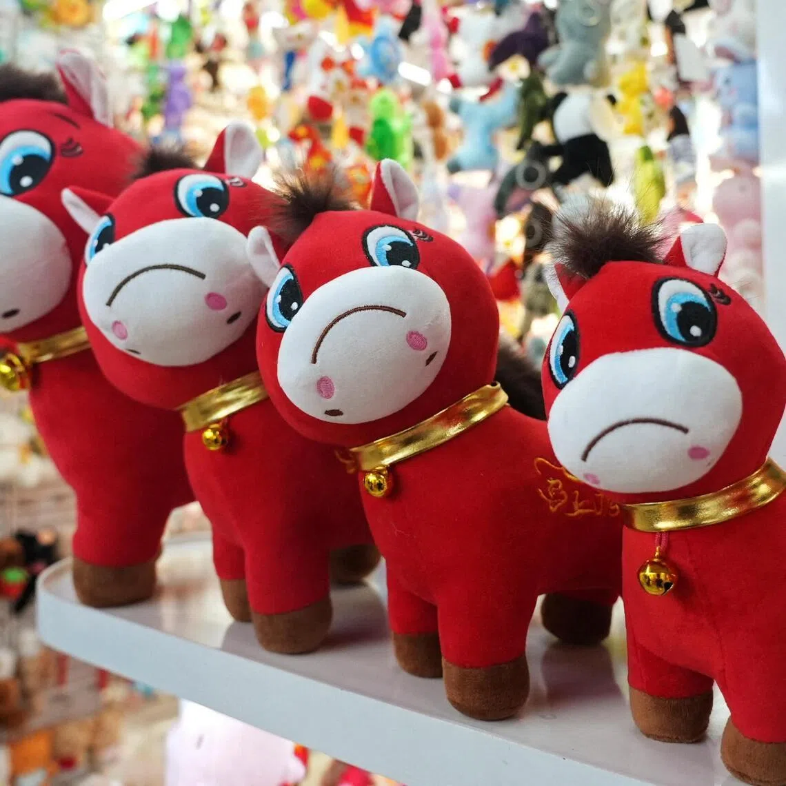 Crying horse plush toys sit on display ahead of the Chinese Lunar New Year, in Yiwu, China, on Jan 21.