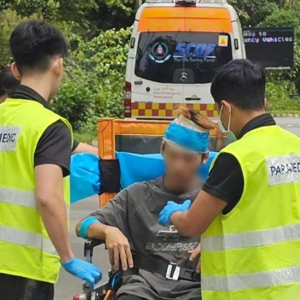 In pictures posted on social media, the 27-year-old man was seen being tended to by three SCDF paramedics.