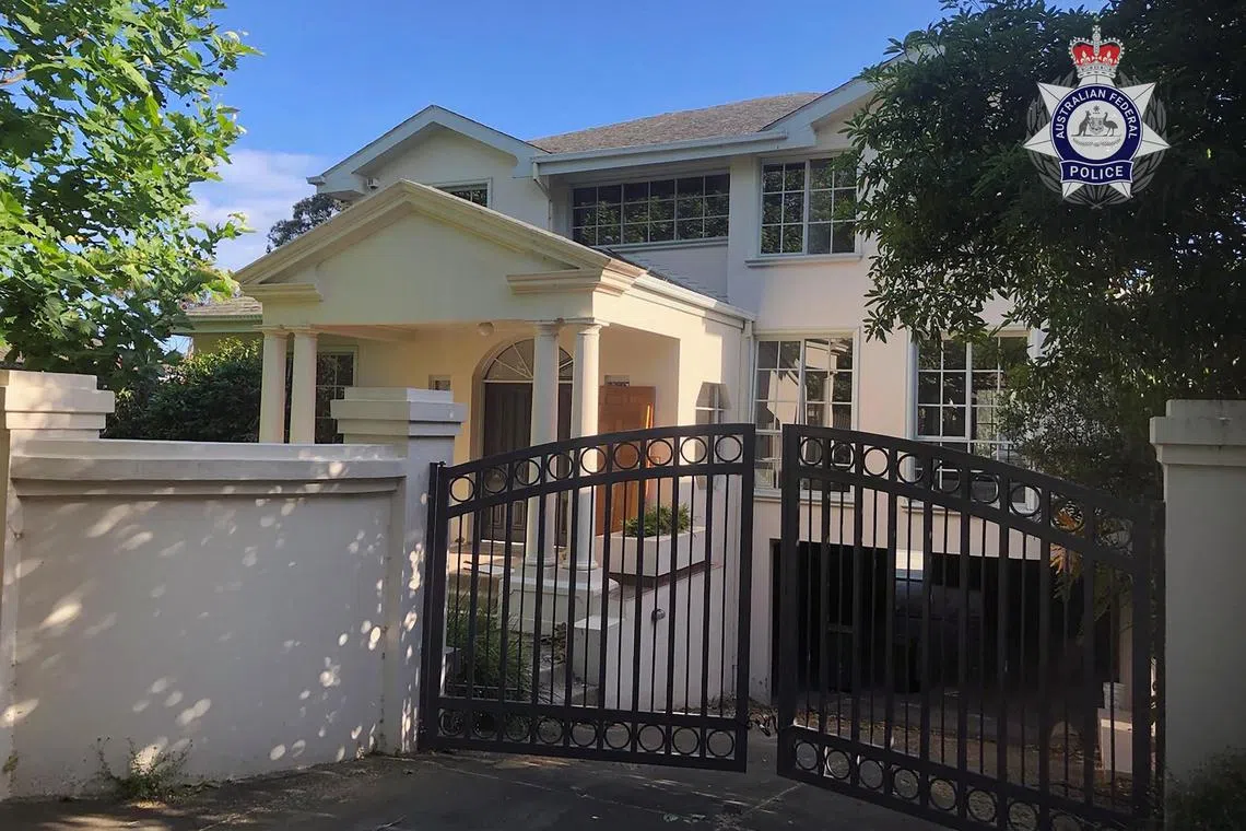 A property subjected to a restraining order is pictured during a countrywide crackdown on a money-laundering crime syndicate in Melbourne, Australia, in this handout photo released on OcT 26, 2023. 
