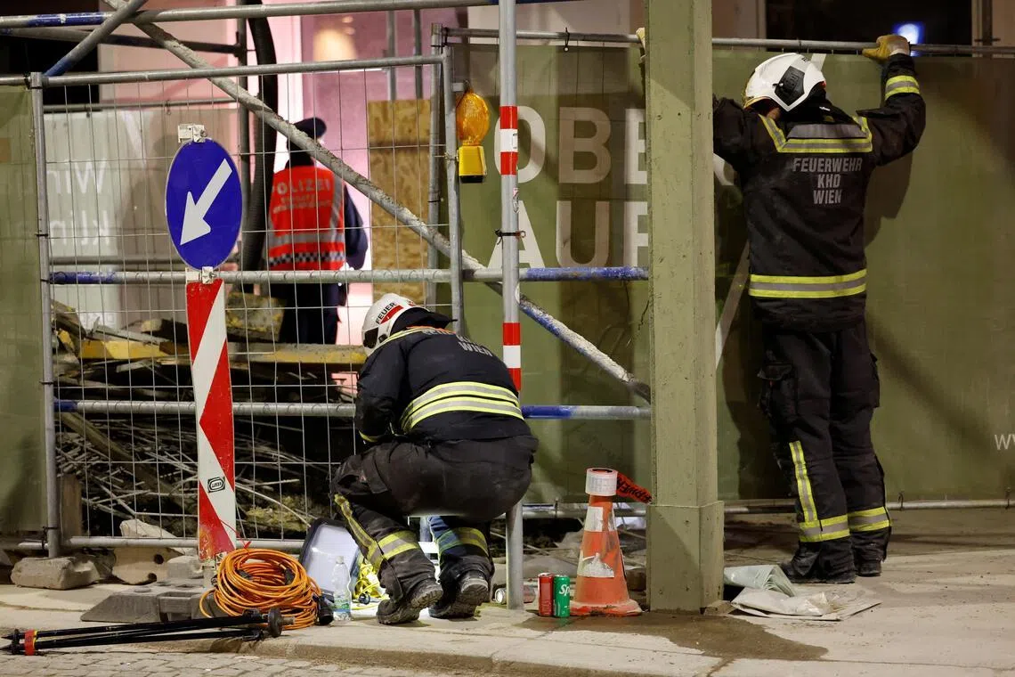Firefighters working at the site of the scaffolding collapse in Vienna, Austria, on March 17.