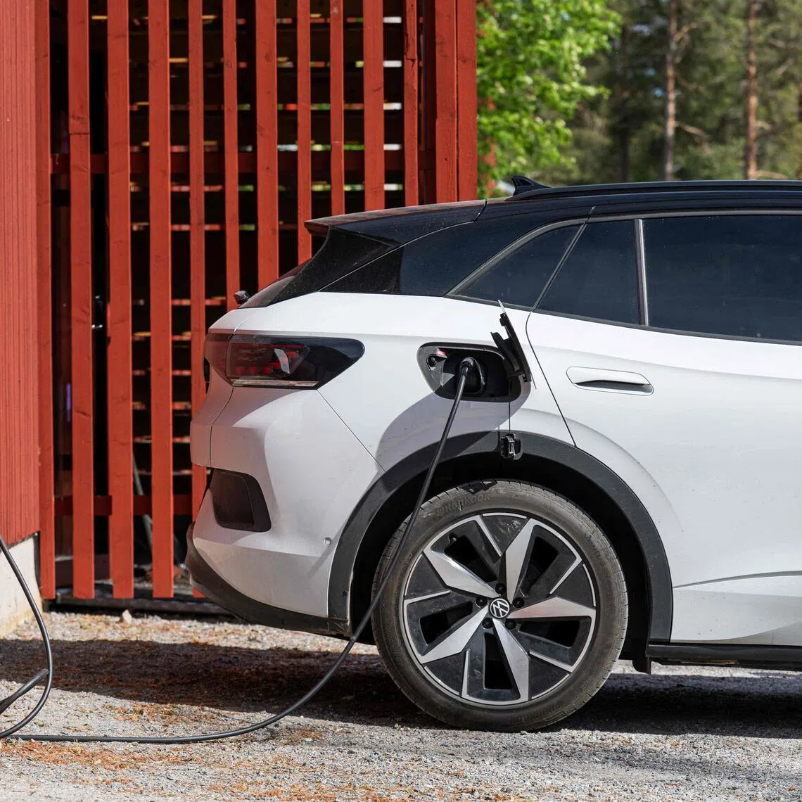 Electric vehicles are connected to charging points by the garage for some Swedish flats, which feeds energy back into the grid with a bidirectional charger.