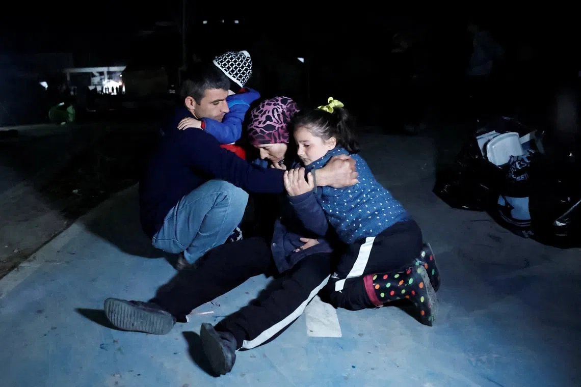 People react after an earthquake in Antakya in Hatay province, Turkey, on Feb 20, 2023. 