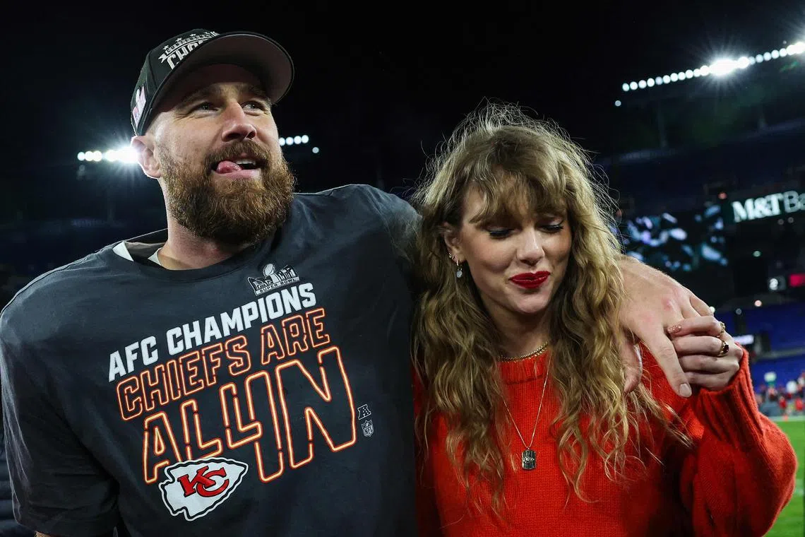 Travis Kelce of the Kansas City Chiefs (L) celebratingwith Taylor Swift after defeating the Baltimore Ravens in the AFC Championship Game.