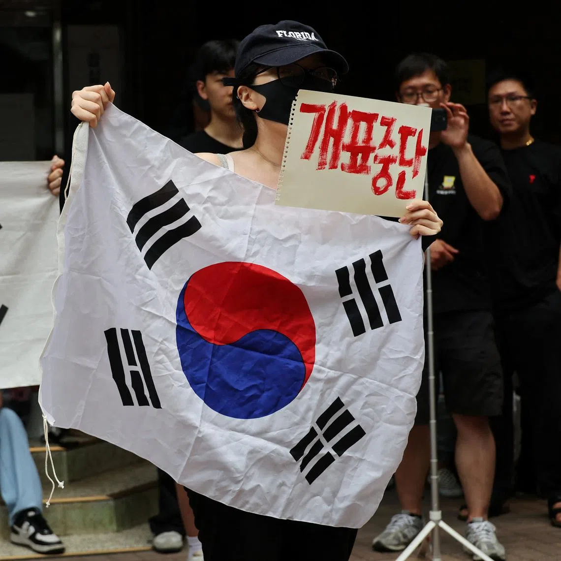 Protesters called for a halt to vote counting and a rerun of the race as they surround a polling station for local elections, in Seoul, South Korea, on June 4.