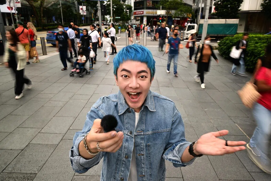 Portrait of Royce Lee pretending to be interviewing somebody at Mandarin Gallery along Orchard road on March 6, 2023.  
Feature on Tiktok street interviewers - including Royce Lee, a content creator who found fame through parodies, skits, and eliciting funny responses from his weekly street interviews.