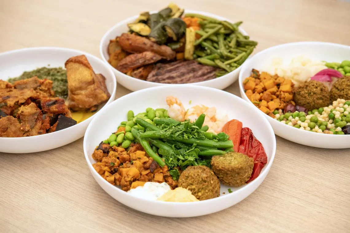 Dishes that will be served to athletes at the Olympic Village in Paris, June 25, 2024. Offerings at the restaurants, like falafel and fregola salad, lean multicultural and vegetarian, and will be served on French porcelain dishware. (James Hill/The New York Times)