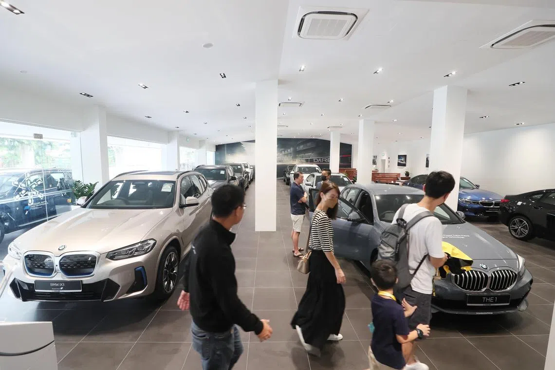 Generic of car showroom and potential customers at BMW