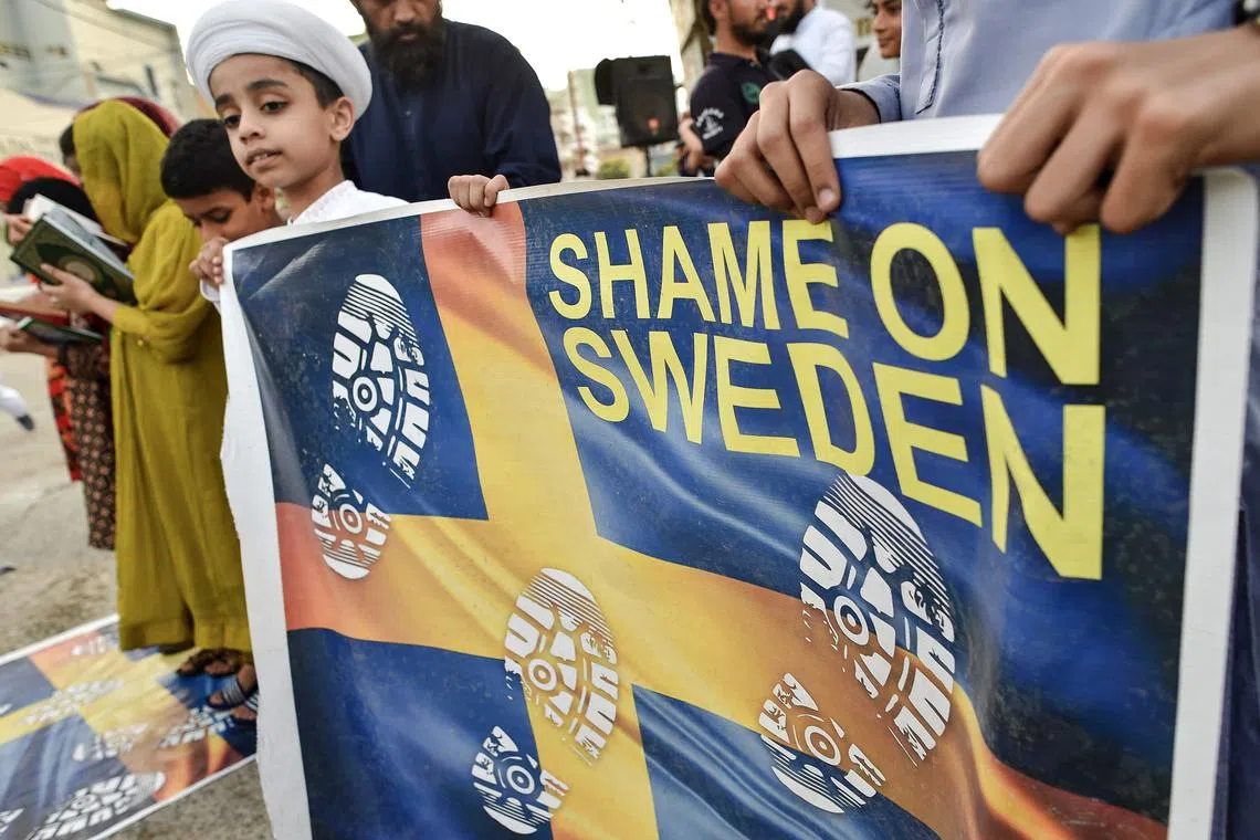 Demonstrators protest against the burning of a copy of the Quran in Sweden, in Karachi, Pakistan, on July 2, 2023.