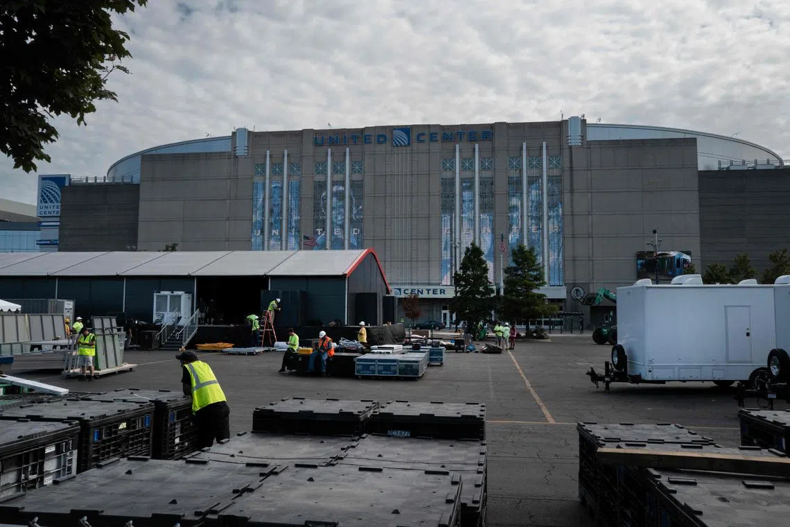 Workers prepare the United Center for the start of the Democratic National Convention on Aug 12, 2024 in Chicago, Illinois. 