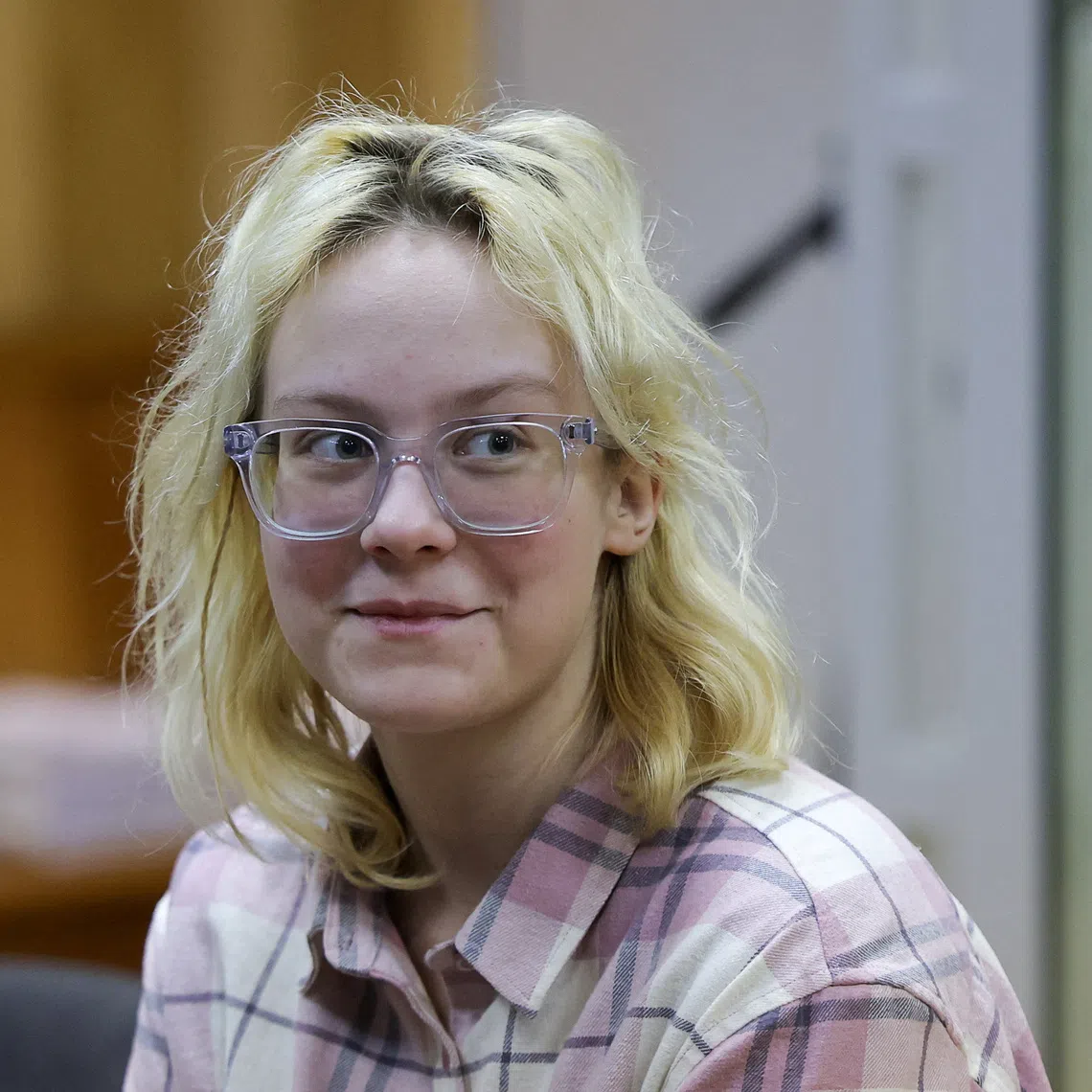 Diana Loginova, a teenage Russian street musician performing under the name Naoko and singing in the Stoptime group who twice served short jail stints for singing anti-Kremlin songs, attends a court hearing as she faces another public order charge in Saint Petersburg, Russia, November 11, 2025. REUTERS/Anton Vaganov