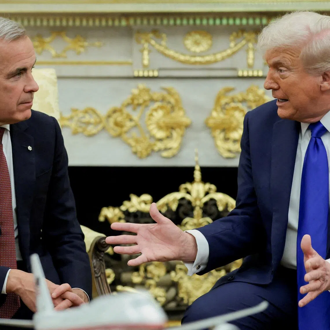 FILE PHOTO: U.S. President Donald Trump and Canada's Prime Minister Mark Carney meet in the Oval Office at the White House in Washington, D.C., U.S., October 7, 2025. REUTERS/Evelyn Hockstein/File Photo