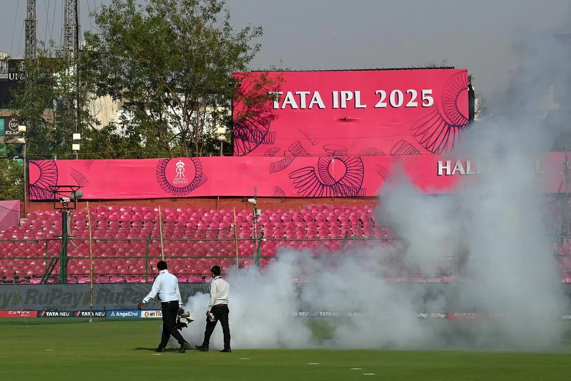Cricket - Indian Premier League - IPL - Rajasthan Royals v Gujarat Titans - Sawai Mansingh Stadium, Jaipur, India - April 28, 2025 Ground staff spray mosquito foggers around the stadium before the match REUTERS/Abhijit Addya