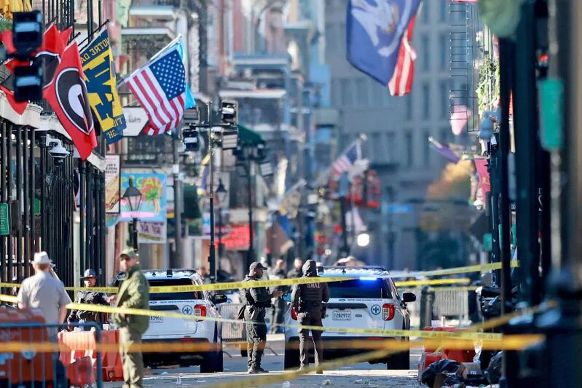 EW ORLEANS, LOUISIANA - JANUARY 1: Law enforcement officers from multiple agencies work the scene on Bourbon Street after at least ten people were killed when a person allegedly drove into the crowd in the early morning hours of New Year's Day on January 1, 2025 in New Orleans, Louisiana. Dozens more were injured after a suspect in a rented pickup truck allegedly drove around barricades and through a crowd of New Year's revelers on Bourbon Street. The suspect then got out of the car, opened fire on police officers, and was subsequently killed by law enforcement. Michael DeMocker/Getty Images/AFP (Photo by Michael DeMocker / GETTY IMAGES NORTH AMERICA / Getty Images via AFP)