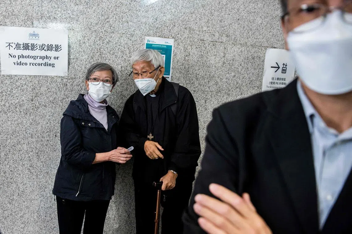 Ex-lawmaker Cyd Ho (left) and Cardinal Joseph Zen (centre) outside the West Kowloon court in Hong Kong on Nov 25, 2022, after being found guilty and fined for failing to register a fund as a society with the police within a specified time in relation to their running of a multi-million dollar defence fund for arrested anti-government protesters. 