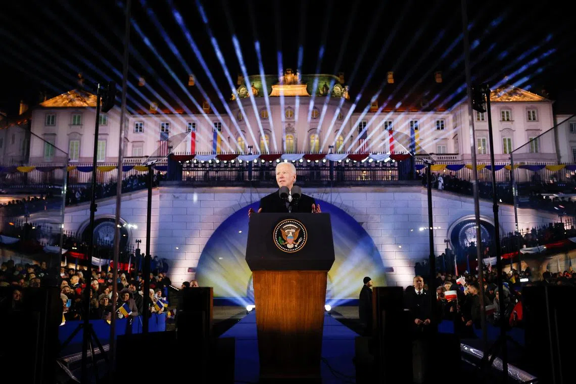 US President Joe Biden delivers remarks ahead of the one year anniversary of Russia's invasion of Ukraine, outside the Royal Castle, in Warsaw.