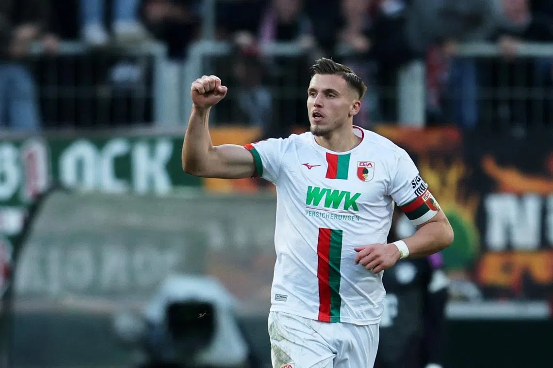 FILE PHOTO: Soccer Football - Bundesliga - FC Augsburg v Bayern Munich - WWK Arena, Augsburg, Germany - January 27, 2024 FC Augsburg's Ermedin Demirovic celebrates scoring their first goal REUTERS/Leonhard Simon/File Photo