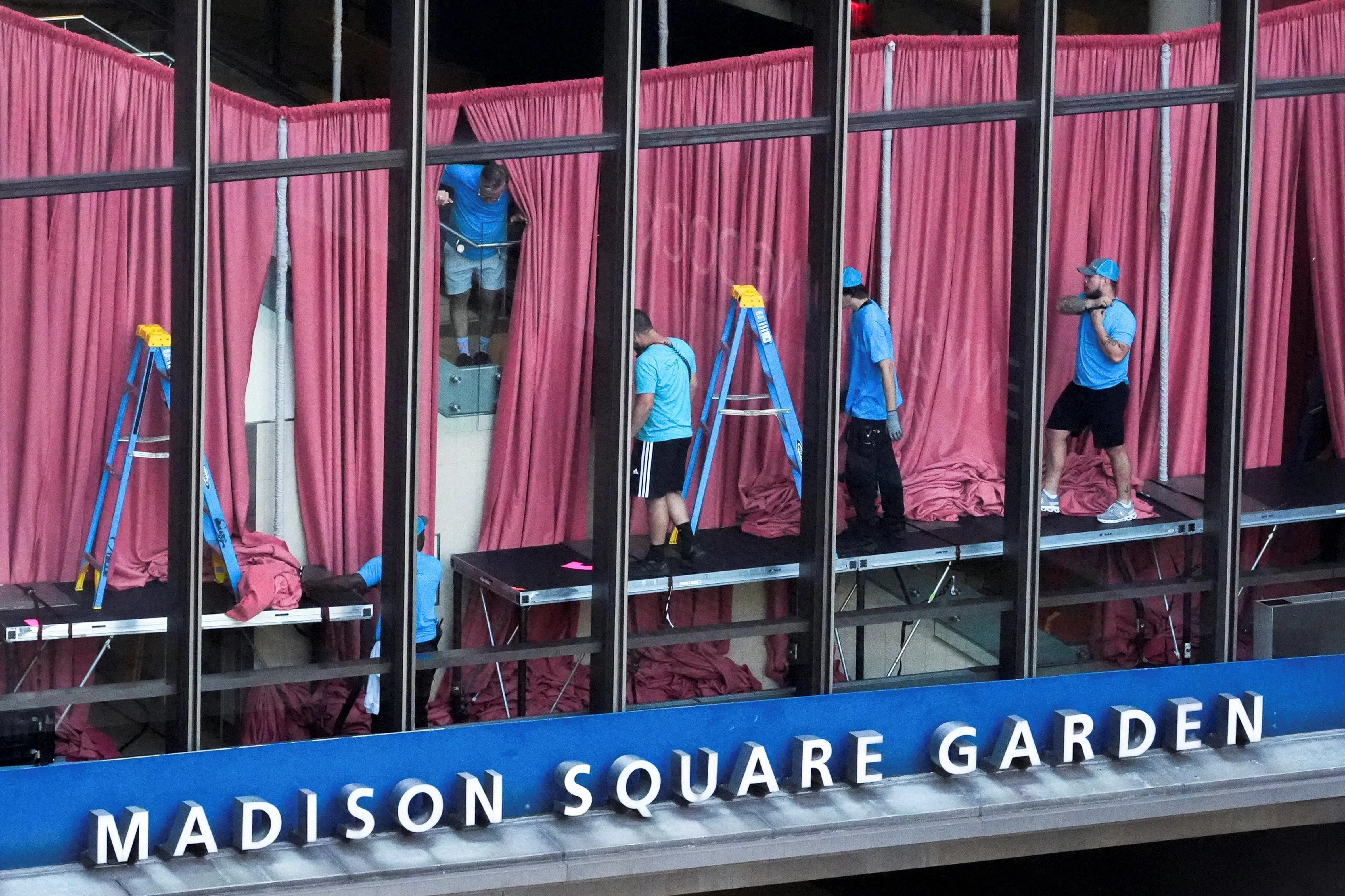 Workers set up courtains inside Madison Square Garden, the venue for the reported wedding celebrations of singer Taylor Swift and National Football League (NFL) player Travis Kelce, in New York, U.S., July 3, 2026. REUTERS/David Dee Delgado     TPX IMAGES OF THE DAY