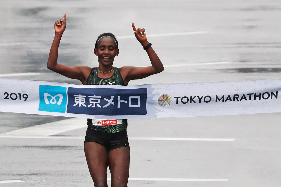 FILE PHOTO: Athletics - Tokyo Marathon 2019 - Tokyo, Japan - 03/03/19 - Women's winner Ruti Aga of Ethiopia crosses the finish line.    REUTERS/Issei Kato/File Photo