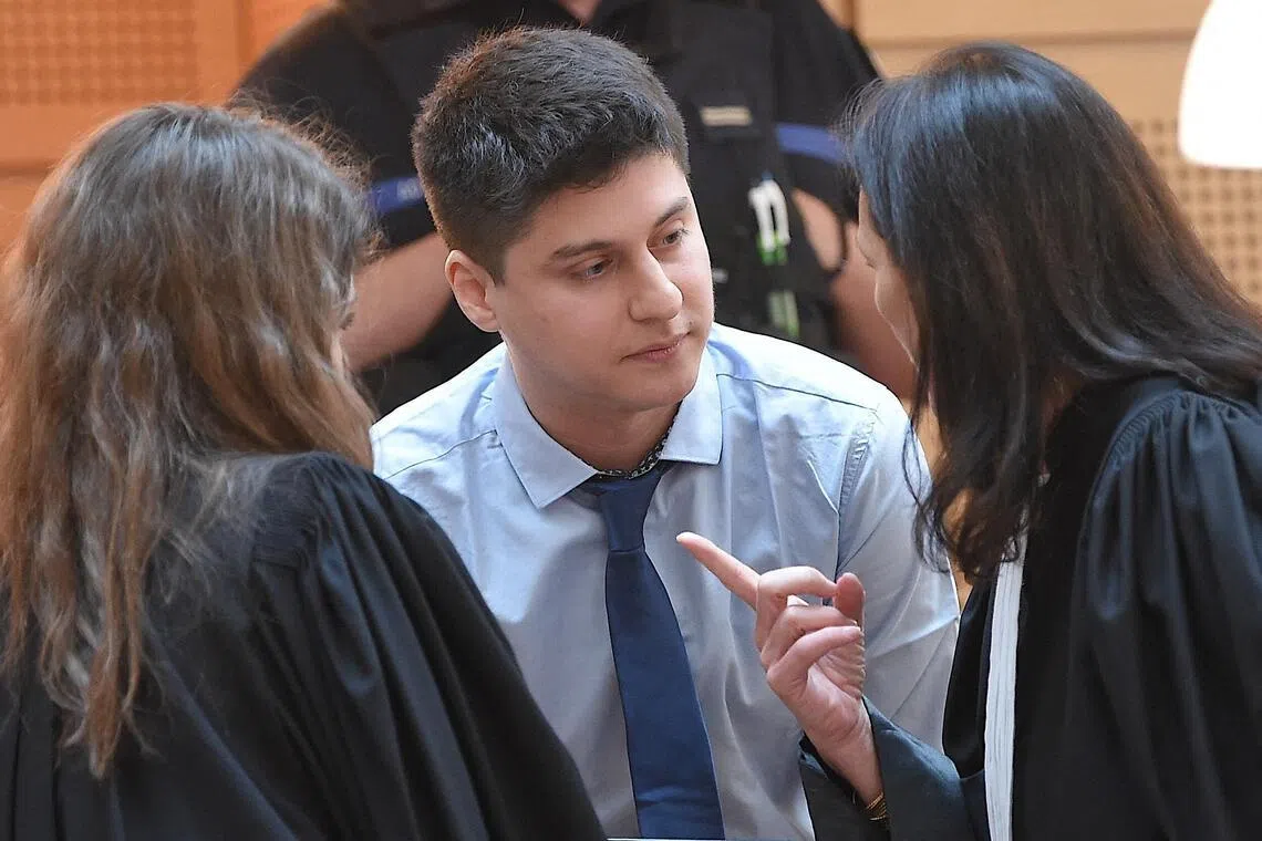 Chilean defendant Nicolas Zepeda (centre) speaking with his lawyers, on the first day of his 2022 trial.